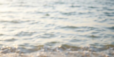 Naklejka premium Soft focus on a serene seaside landscape with gentle waves and soft sunlight, wavy lines, misty sky