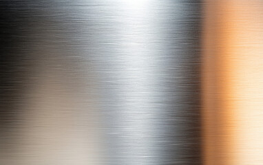 A close-up of brushed metal texture showcasing silver and warm tones, ideal for backgrounds and industrial-themed designs.
