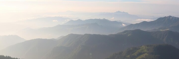 Naklejka premium Alpine peaks and valleys shrouded in morning mist, scenic view, morning mist, peaceful atmosphere