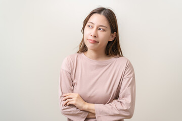 Fototapeta premium Portrait of positive thinking, pretty asian young woman wear casual style clothing looking away empty think about creative in future, thoughtful plan expression face guess and unsure have a question.