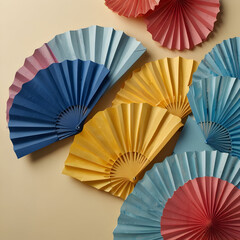 Blue paper hearts and fans on a light