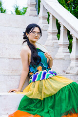 Asian girl wearing colorful traditional costumes