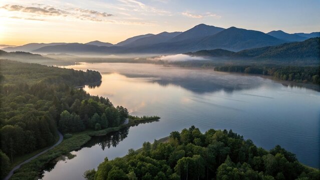 Aerial view of a serene lake at sunrise with mountains in the background, lake, aerial view, nature