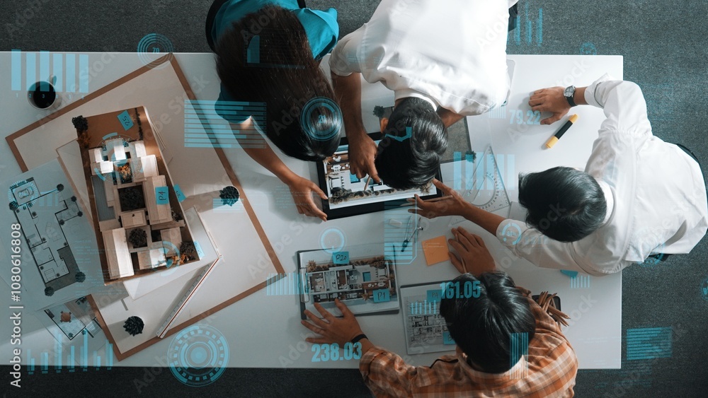 Aufkleber top down aerial view of team looking at blueprint and talking about financial chart or investment st