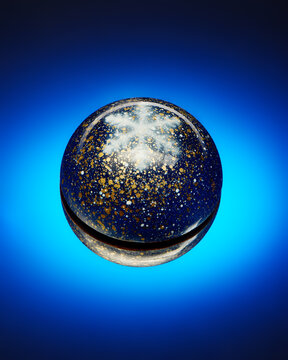 Chocolate candy with white snowflake on bright blue background