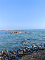 Rocky Coastline with Jagged Reefs and Rugged Terrain