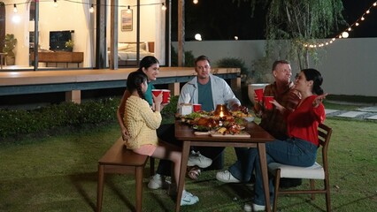 Family gather celebrate holiday. Parents, grandparents and girl together to talk and have dinner party food. Outdoor activity for spending time with multigeneration cross generation gap. Divergence.