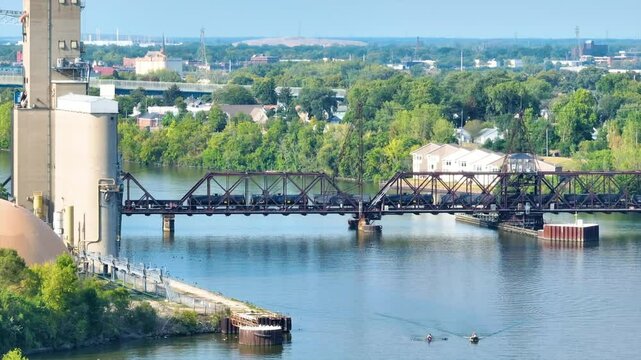 Aerial of Toledo Train Trestle Over River with Rowers