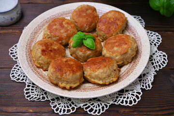 delicious meat cutlets on the table with a knitted napkin close-up, serving