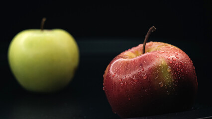 The minimalist still life of a green and red apple, symbolizing variety and freshness.