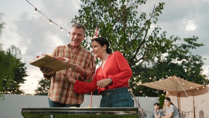 Family all together camp in garden, Old couple grill food for family member. Outdoor camping...