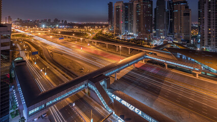 Obraz premium Aerial top view to Sheikh Zayed road near Dubai Marina and JLT night to day timelapse, Dubai.