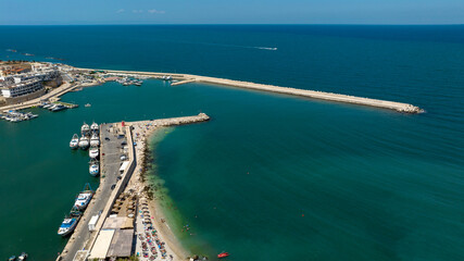 Aerial view of a pier on the Mediterranean Sea.