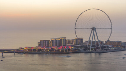 Obraz premium Bluewaters Island in Dubai aerial day to night timelapse after sunset.