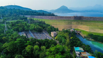 Obraz premium Aerial View of Jatiluhur, the Largest Dam in Indonesia. Bendungan Jatiluhur of Purwakarta. Multi-Purpose Embankment Dam on The Citarum River with Morning Glory Spillway