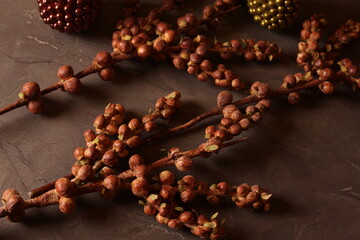 Cozy autumn decor with candles, pinecones, and berries, creating a rustic, seasonal ambiance perfect for fall.