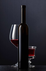 Bottle and glasses of red wine.