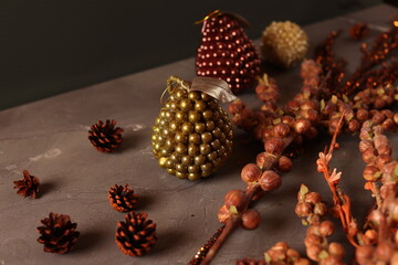 Cozy autumn decor with candles, pinecones, and berries, creating a rustic, seasonal ambiance perfect for fall.