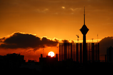 sunset over the city, City sunset, City silhouette, City silhouette against the cloudy sunset sky, Tehran-Iran, Milad tower silhouette