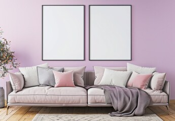 A modern living room with a gray sofa. a white throw blanket. and two empty picture frames hanging above The walls are a soft lavender color. and the room is decorated with a dried flower arrangement