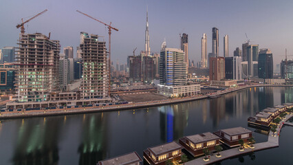 Obraz premium The rhythm of the city of Dubai from night to morning aerial timelapse