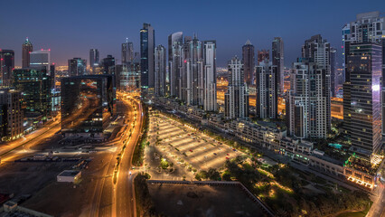 Panorama of Business bay Dubai night to day aerial timelapse.
