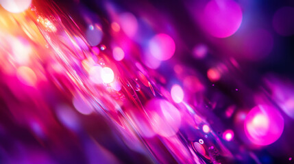 Vibrant abstract background featuring colorful light trails and bokeh effects in shades of pink, purple, and orange during twilight