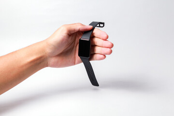 Male hand holding smart watch on isolated background