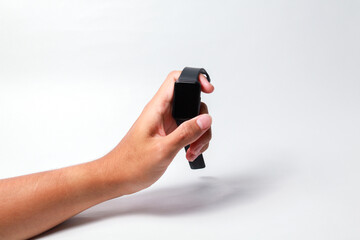 Male hand holding smart watch on isolated background