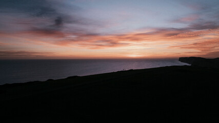 Evening view of the sea and an island in the dark and only the sky is shining