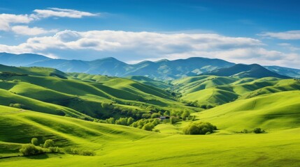 Obraz premium Lush green hills and a winding river create a breathtaking landscape.