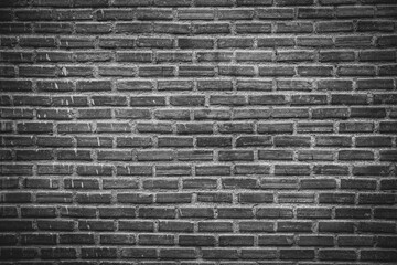 Aged black and white brick wall with vintage texture can be use as background. 