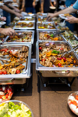 Diverse buffet spread featuring a variety of dishes at a community gathering