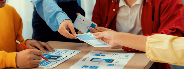 Panorama banner of startup company employee planning on user interface prototype for mobile application or website in office. UX UI designer brainstorm user friendly interface plan. Synergic