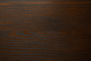 Texture of wooden surface after applying walnut wood stain as background, top view