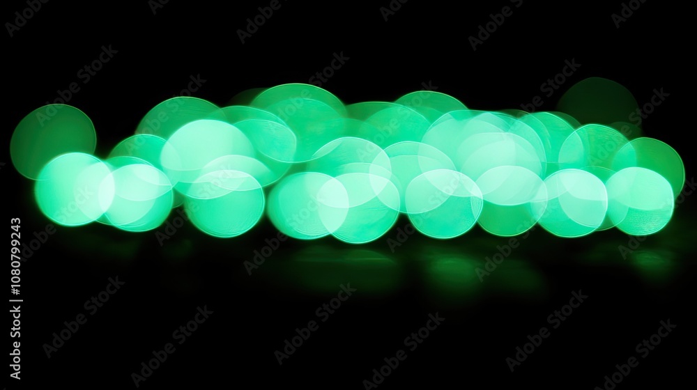 Poster bright green light bokeh flares on black, perfect for adding depth and sparkle to overlays or backgr