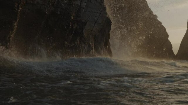 Close up cinematic shot of a sea waves hitting the coasts 
