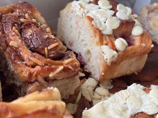 Closeup of Cinnamon Rolls and White Chocolate Pastries