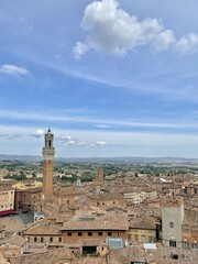 Fototapeta premium View of Piazza del Campo, Palazzo Pubblico, and Torre del Mangia on a Summers Day in Siena, Italy