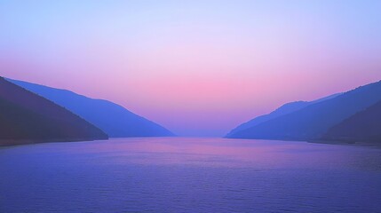Beautiful serene landscape of a calm river flowing through gentle hills at dusk with a pastel sky and soft color gradients reflecting in the water's surface