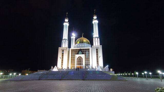 Mosque Nur Gasyr in the city of Aktobe night timelapse hyperlapse. Kazakhstan