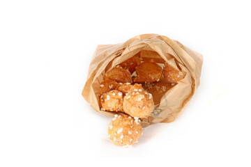 Chouquettes on a white background, small French choux pastries topped with pearl sugar