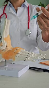Medical ganglion foot cyst with bones and doctor injection. Large ganglion cysts vertical 
