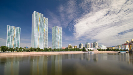 Ishim River with modern towers of residential complex timelapse hyperlapse in Astana