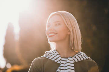 Photo of attractive young lady wondered look smile sunny weather wear khaki garment tied shoulders...