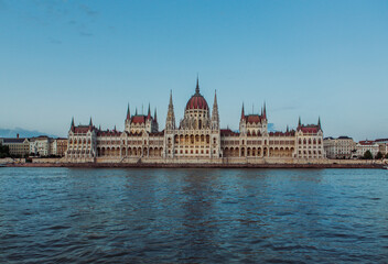 Majestic Hungarian Parliament Building with the Danube River in the Foreground: Iconic Views of Budapest's Historic Landmark