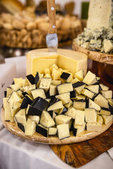 parmesan cheese with gorgonzola cheese, served on a wooden board, typical Brazilian food, served at parties and buffets