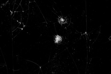 Black glass with cracks as a background.