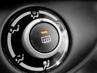 Defrost Button in Car On Orange Light