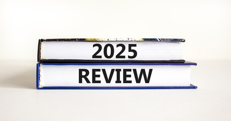 Planning 2025 review new year symbol. Concept words 2025 Review on beautiful books. Beautiful white background. Business 2025 review new year concept. Copy space.